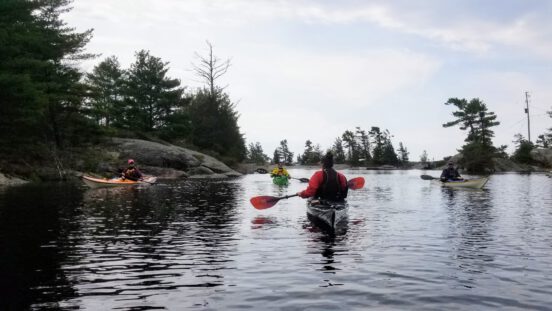 Students learning in a sea kayak course on Georgian Bay