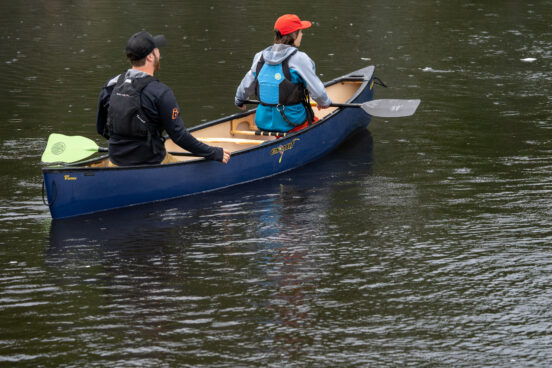 Two people in a canoe on the water.